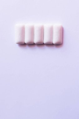Top view of chewing gums on white background with copy space clipart