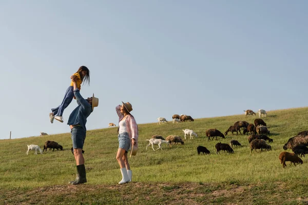 Side View Farmer Raising Daughter Wife Herd Grazing Green Pasture — 스톡 사진
