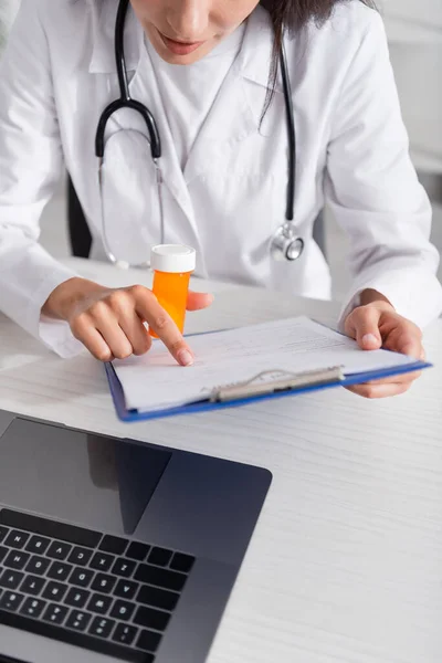 Cropped View Doctor Holding Clipboard Pills Laptop Hospital — 스톡 사진