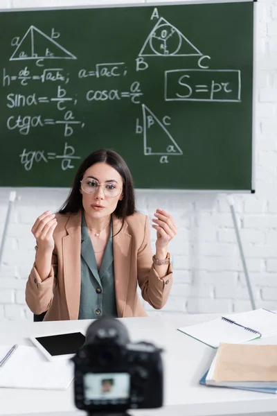 Teacher Talking Blurred Digital Camera Chalkboard Math Formulas Classroom — Stockfoto