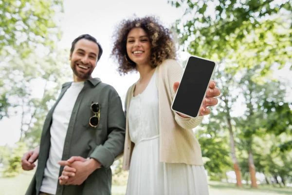 Low Angle View Happy Curly Woman Holding Smartphone Blank Screen — Foto de Stock