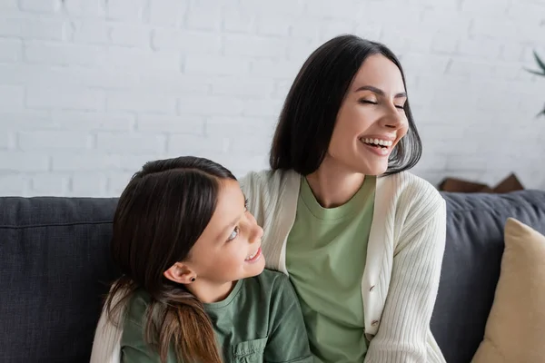 Happy Brunette Girl Looking Babysitter Closed Eyes Laughing Home — 图库照片