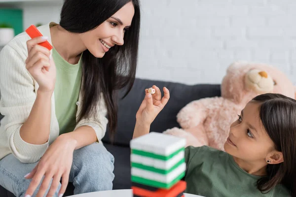 Cheerful Babysitter Playing Wood Blocks Game Girl Living Room — Fotografia de Stock