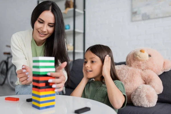 Happy Babysitter Playing Wood Blocks Game Smiling Girl Living Room — Stockfoto