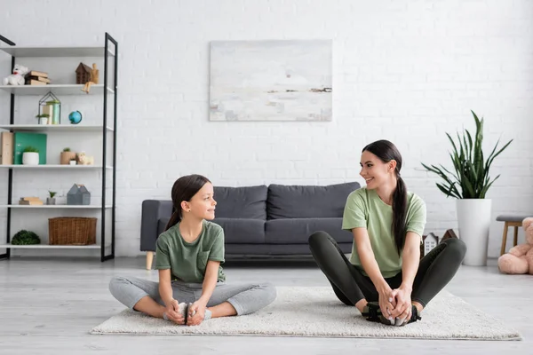 Girl Babysitter Smiling Each Other While Sitting Carpet Fire Log - Stock-foto