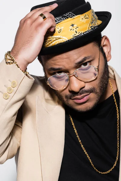 Portrait Eastern Hip Hop Singer Eyeglasses Adjusting Fedora Hat Isolated — Stock Photo, Image