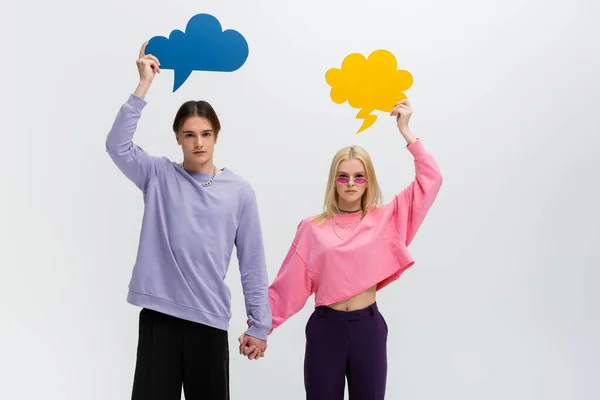 Stylish Couple Holding Hands Thought Bubbles Isolated Grey — Stock Photo, Image