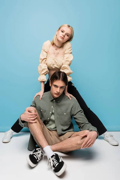 Stylish Young Couple Sneakers Posing Blue Background — Zdjęcie stockowe