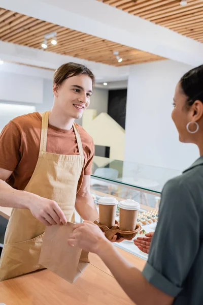 Smiling Seller Giving Coffee Paper Bag African American Customer Confectionery — Φωτογραφία Αρχείου