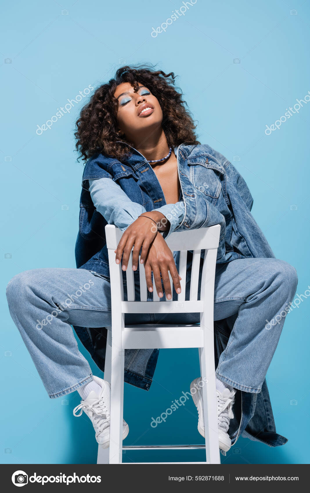 Trendy African American Woman Denim Clothes Posing Chair Closed Eyes Stock  Photo by ©HayDmitriy 592871688