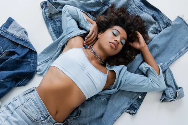 Top View African American Woman White Crop Top Lying Denim — Stock Photo, Image