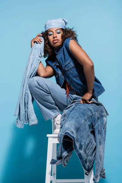 African American Woman Posing Chair Denim Garments Blue Background — Stock fotografie