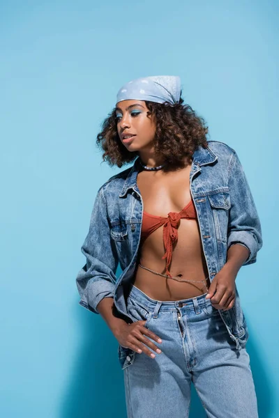 Curly African American Woman Denim Jacket Swim Bra Blue Background — Zdjęcie stockowe