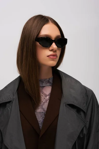 Brunette Teenage Model Stylish Sunglasses Trendy Trench Coat Isolated Grey — Photo