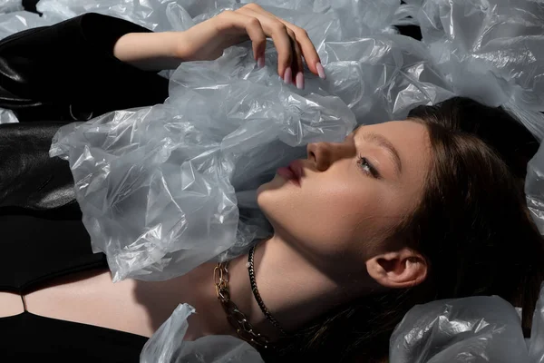 Top View Teenage Model Lying Plastic Bags Recycle Fashion Concept — Fotografia de Stock