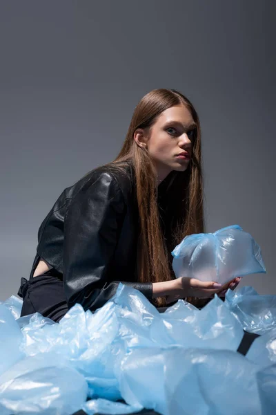 Brunette Model Stylish Black Suit Posing Blue Plastic Bags Grey — Stock Photo, Image