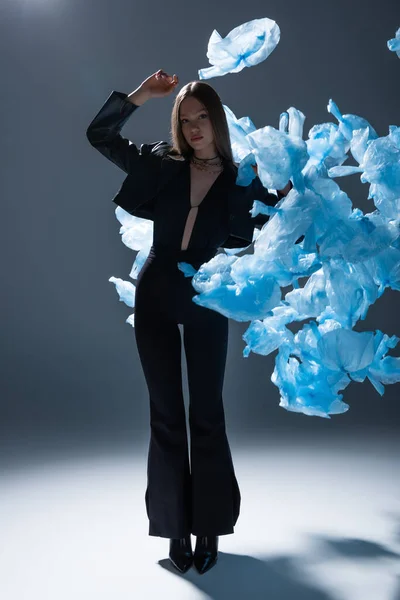 Full Length Brunette Model Stylish Suit Posing Flying Blue Plastic —  Fotos de Stock