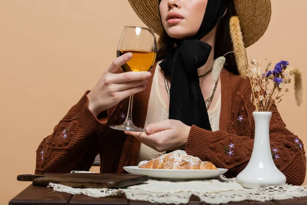 Cropped View Trendy Woman Holding Wine Croissant Plants Table Isolated — Stock Fotó