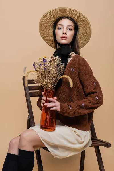 Trendy Woman Sun Hat Holding Plants Vase Isolated Beige — Stockfoto