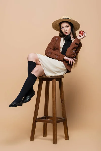 Stylish Woman Straw Hat Holding Apple While Sitting Chair Beige — 图库照片