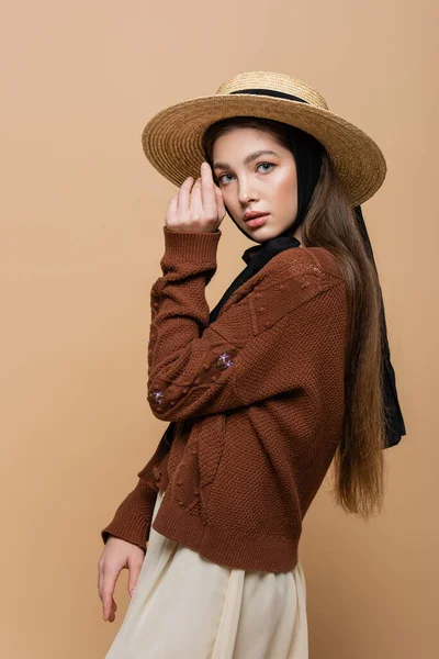 Brunette Woman Straw Hat Knitted Cardigan Looking Camera Isolated Beige — Zdjęcie stockowe