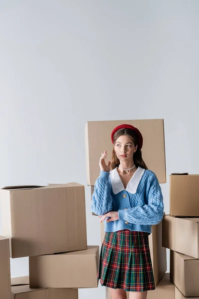 Stylish Model Beret Knitted Cardigan Posing Carton Boxes Isolated Grey — Stock Photo, Image