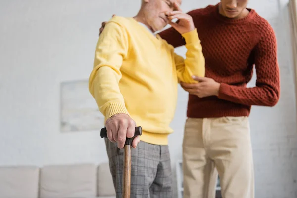 Walking Cane Hand Blurred Upset Pensioner African American Grandson Home — Foto de Stock