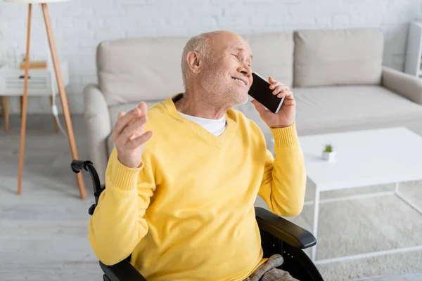 Positive Pensioner Talking Smartphone While Sitting Wheelchair Home — Zdjęcie stockowe