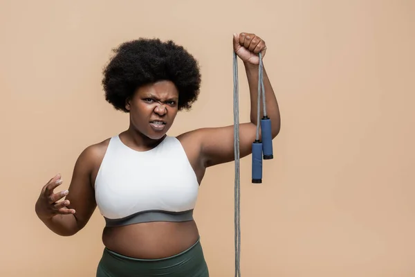 Displeased African American Size Woman Sportswear Holding Skipping Rope Isolated — Fotografia de Stock