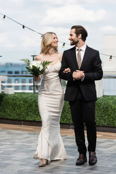 Smiling Bride Holding Bouquet Looking Groom Terrace — Stockfoto
