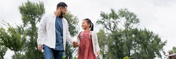 Cheerful Asian Father Daughter Holding Hands Park Banner — Stok fotoğraf