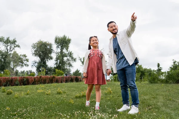 Cheerful Asian Daughter Dad Looking Away Summer Park —  Fotos de Stock