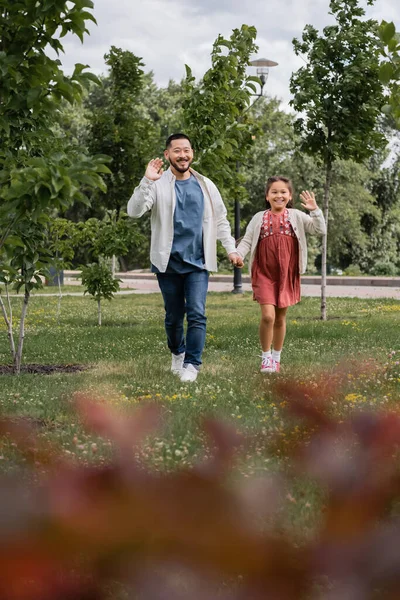 Positive Asian Parent Kid Waving Hands Summer Park — Photo