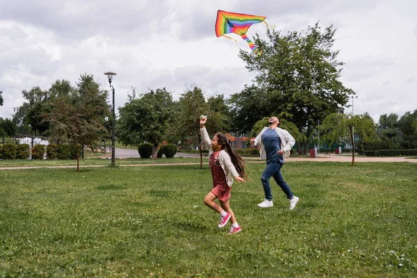 Happy Asian Family Playing Flying Kite Summer Park - Stock-foto