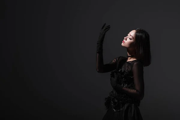 Sensual Asian Woman Gothic Dress Gesturing Isolated Grey — Stock fotografie