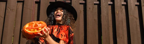 Low Angle View Curly Girl Witch Halloween Costume Laughing Spooky — Stock Photo, Image