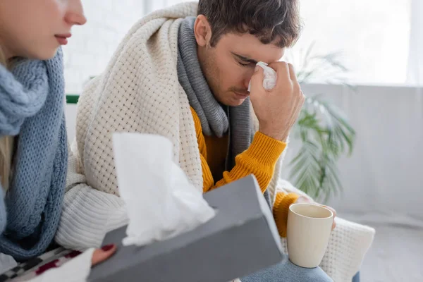 Sick Man Closed Eyes Holding Napkin Cup Girlfriend Tissue Box — Stock Photo, Image