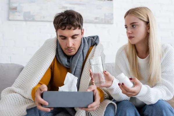 Caring Young Woman Giving Glass Water Bottle Pills Sick Boyfriend — Stock Photo, Image