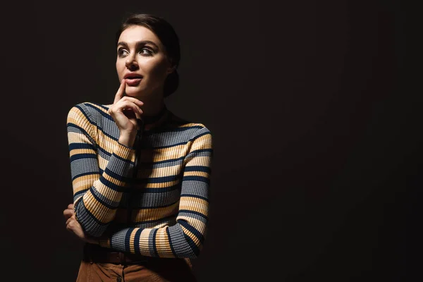 Dreamy Young Woman Striped Turtleneck Looking Away Isolated Black — Stock Photo, Image