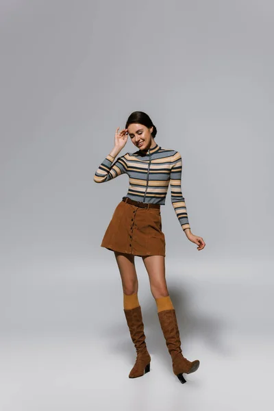 Full Length Cheerful Young Woman Striped Turtleneck Skirt Boots Standing — Stock Photo, Image