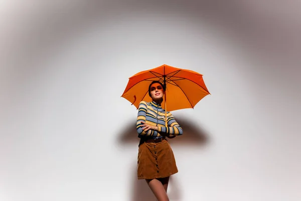 Brunette Young Woman Striped Turtleneck Skirt Standing Orange Umbrella Grey — Stock Photo, Image