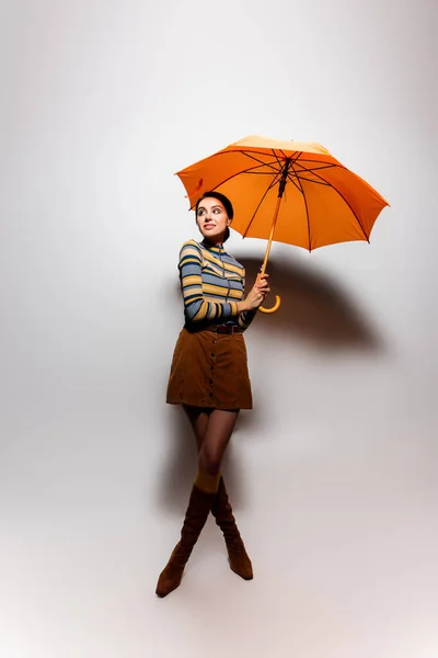 Full Length Smiling Young Woman Striped Turtleneck Skirt Posing Orange — Stock Photo, Image