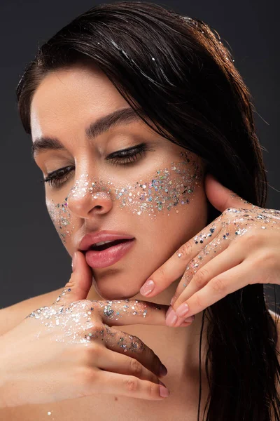 Young Brunette Woman Sparkling Glitter Cheeks Hands Touching Face Isolated — Stock Photo, Image