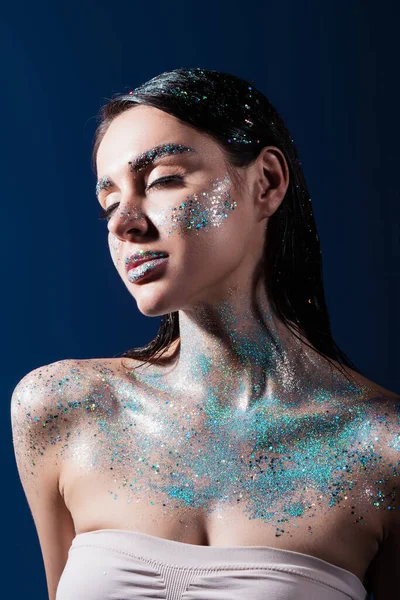 Portrait Brunette Young Woman Closed Eyes Glitter Body Isolated Blue — Stock Photo, Image