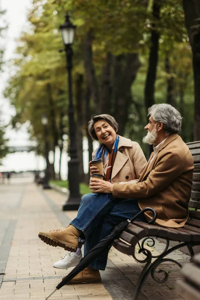 Full Length Happy Senior Couple Coats Holding Paper Cups While — Stock Photo, Image