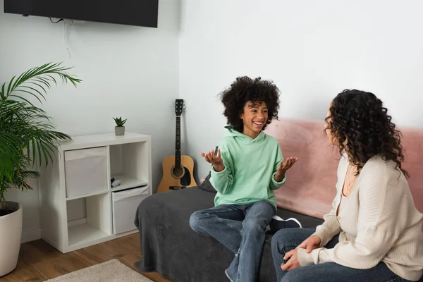 Curly African American Girl Smiling While Gesturing Mother Living Room — Stock Photo, Image