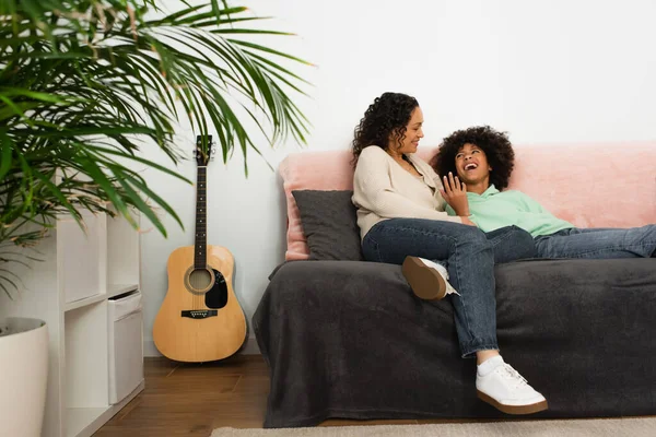 Excited African American Girl Looking Mother While Resting Couch — Stock Photo, Image