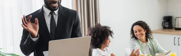 Cheerful African American Man Suit Using Laptop While Girl Showing — Stock Photo, Image