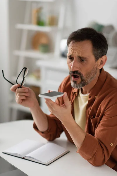 Shocked Man Holding Eyeglasses Sending Voice Message Mobile Phone — Stock Photo, Image