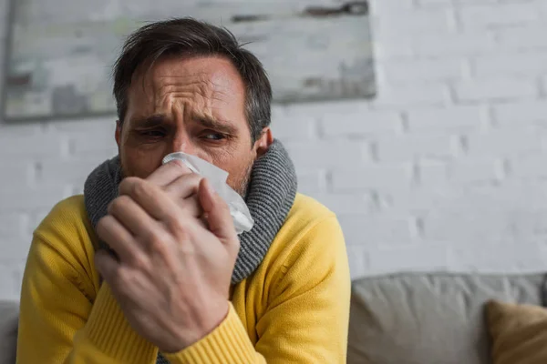 Sick Man Warm Scarf Suffering Rhinitis Holding Paper Napkin Face — Stock Photo, Image